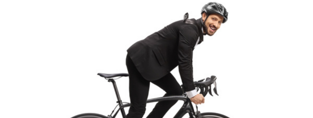 riding a bike in a business suit