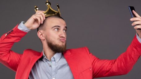 taking a selfie wearing a crown - feature